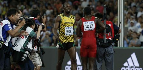 Bolt sofreu nas semifinais com um desequilíbrio no início da prova  / ADRIAN DENNIS / AFP
